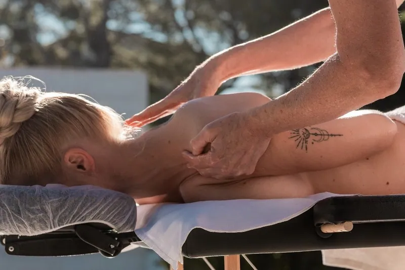 A massage beside the pool of a Calma villa