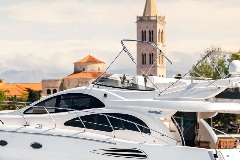A motor yacht under way off the old town of Zadar