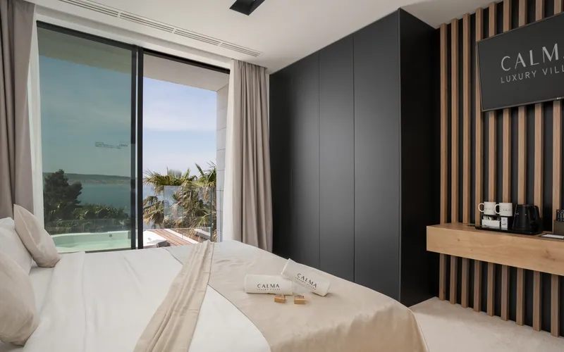 Bedroom in Villa Calma I with the sea beyond the terrace