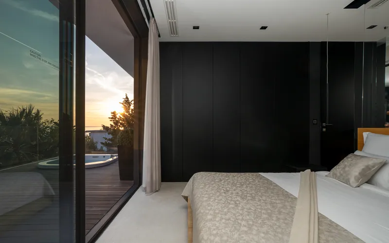 Bedroom at sunset beside the jacuzzi deck