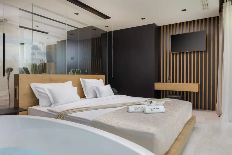 Bedroom with a freestanding bath in the foreground