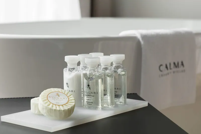 Bath amenities laid out beside the freestanding bath
