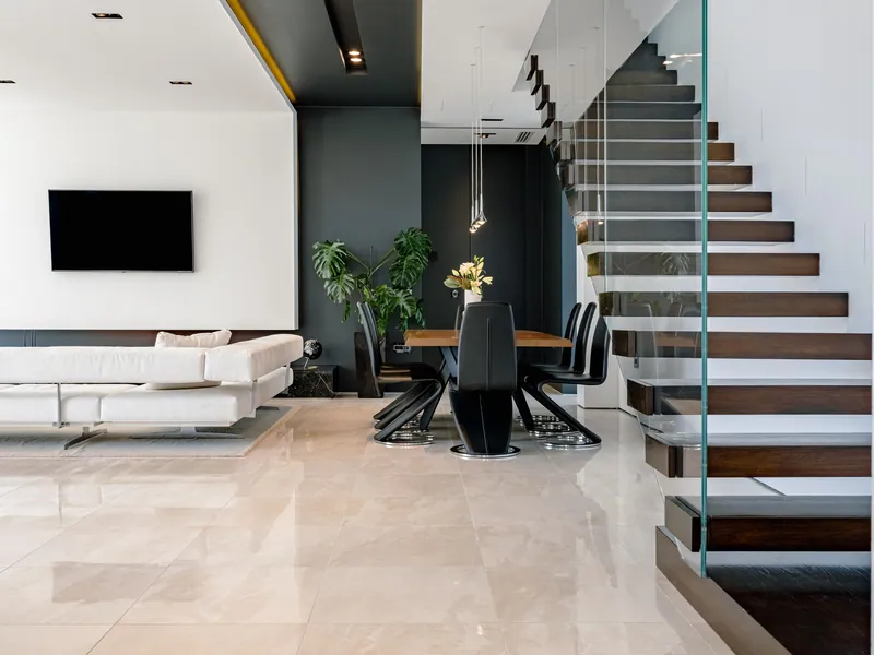Living room, dining table and the floating staircase