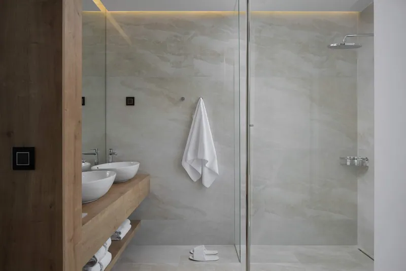 Bathroom with twin basins and a walk-in rain shower